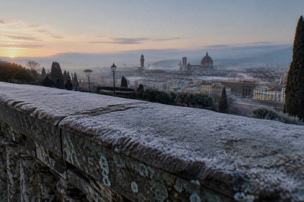 Stone parapet of Piazzale Michelangelo with the city skyline and cathedral dome beyond